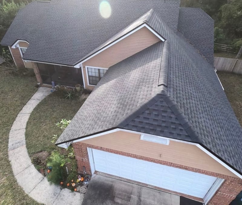 Completed dark asphalt-shingle roof seen from above